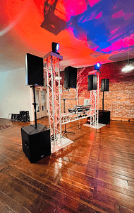 DJ Addy - PNW Weddings - DJ - Oregon Washington Idaho - DJ Station Neon Lights Speakers Dance Floor Brick Walls Music-min